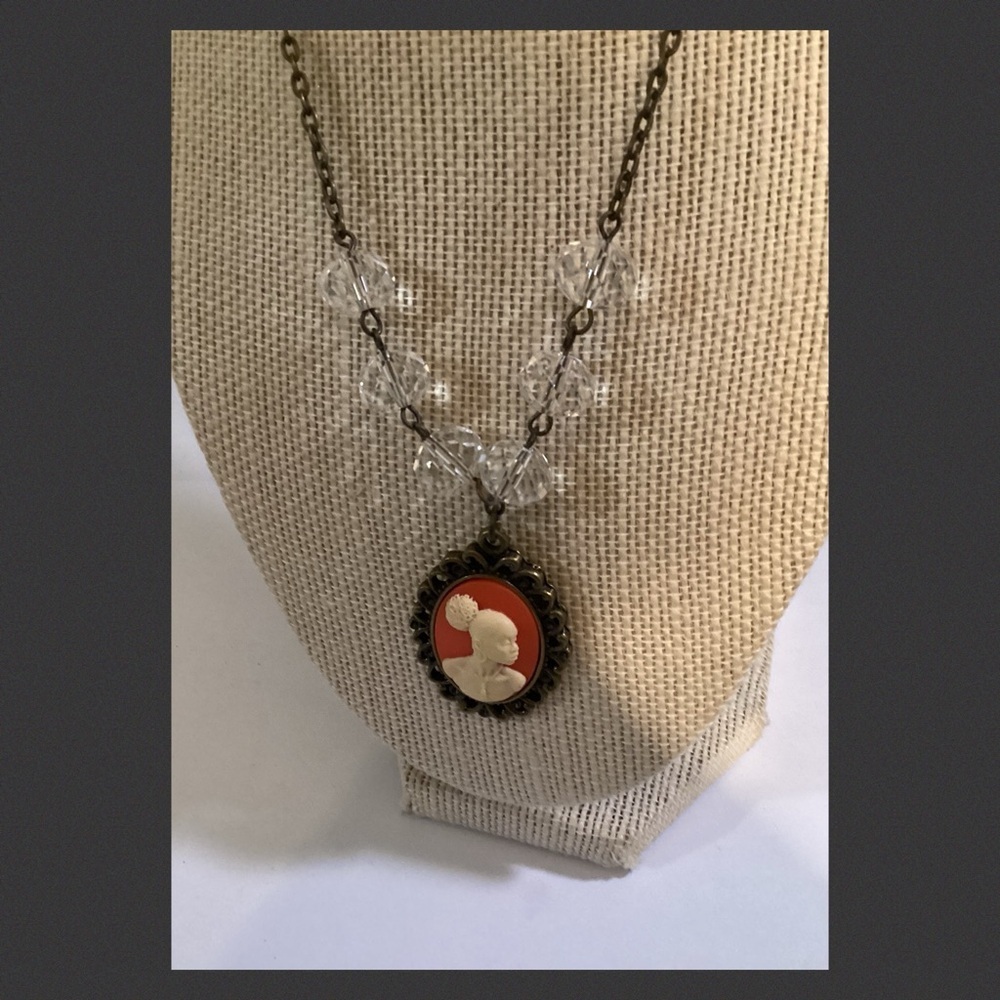 Orange crystal lady cameo necklace.